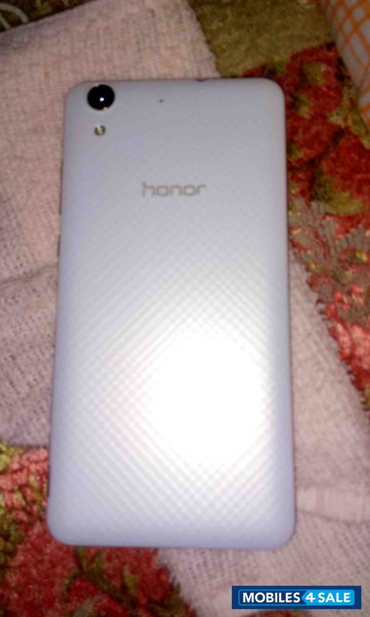 White Huawei Honor Holly 3