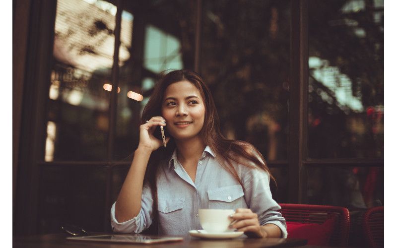Young Asian Woman Talking On Phone